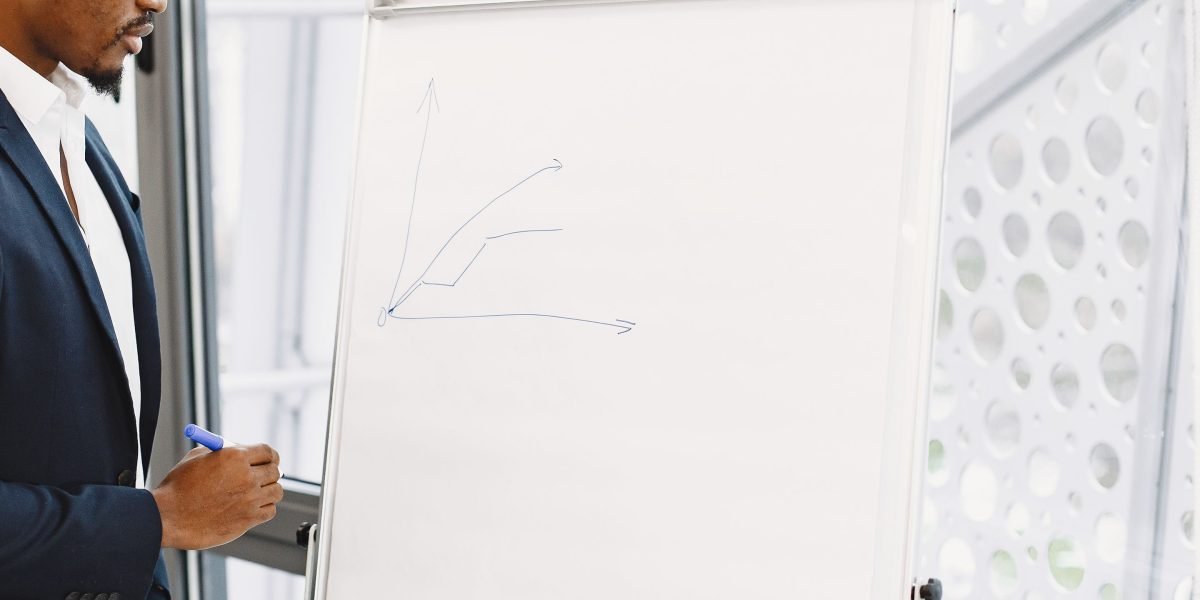 A small business owner experiences a moment of clarity while planning their online strategy.