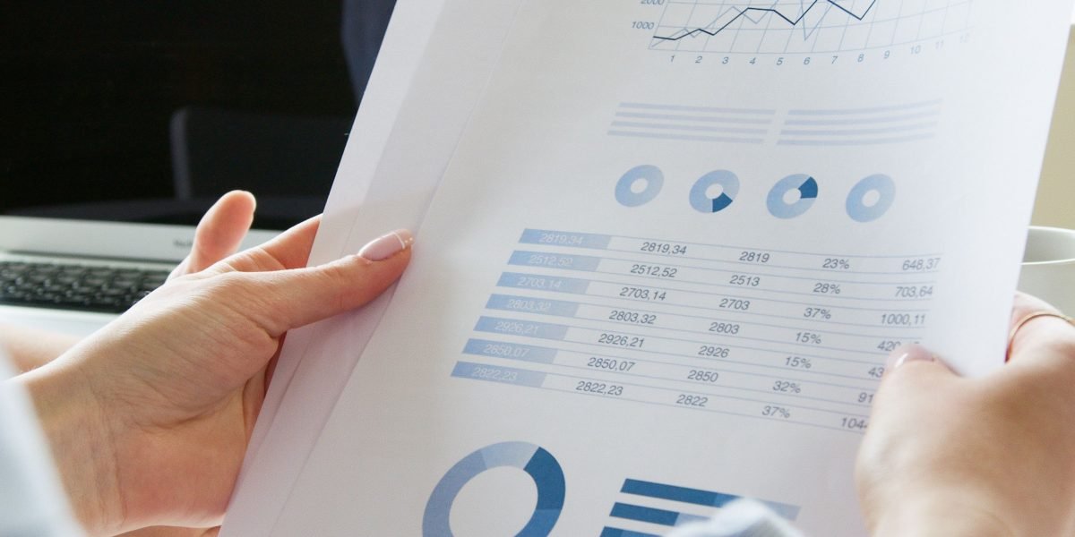A business owner confidently reviews performance reports, understanding the impact of their marketing spend.