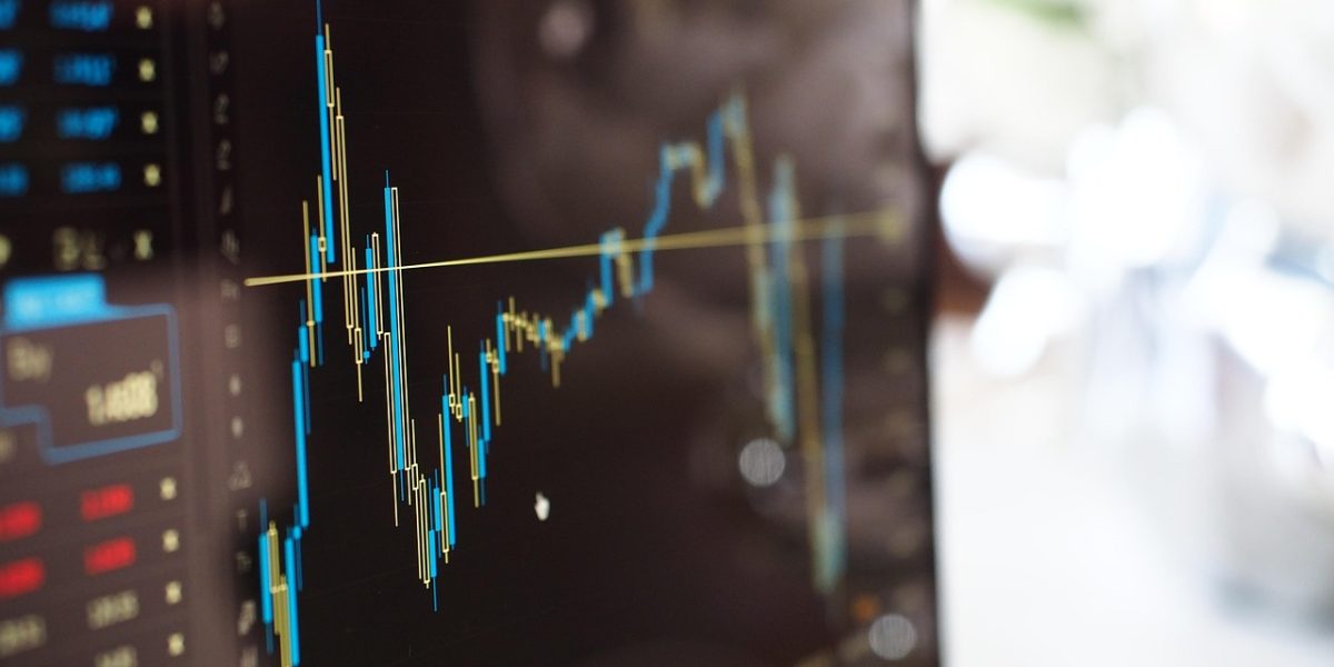 A person analyzes various data charts and graphs, highlighting the data-driven nature of modern UI/UX design decisions.