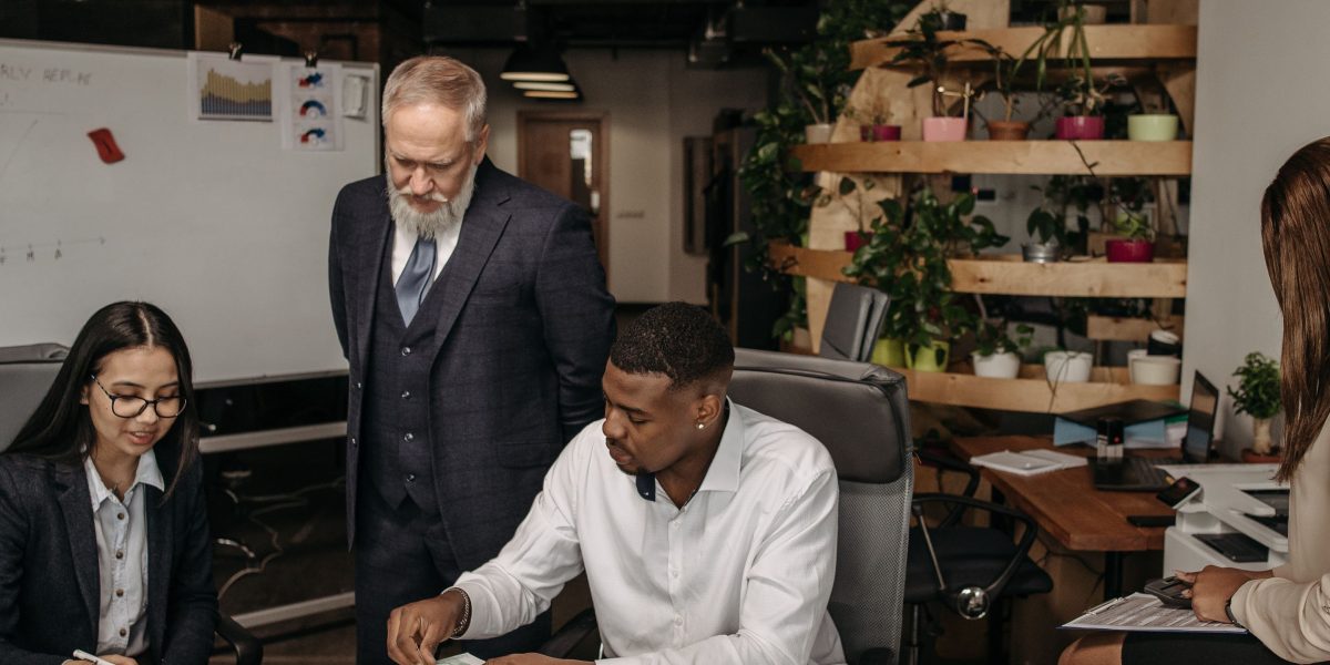 A team collaborating to make informed strategic decisions, representing the proactive approach to avoid common hiring mistakes.