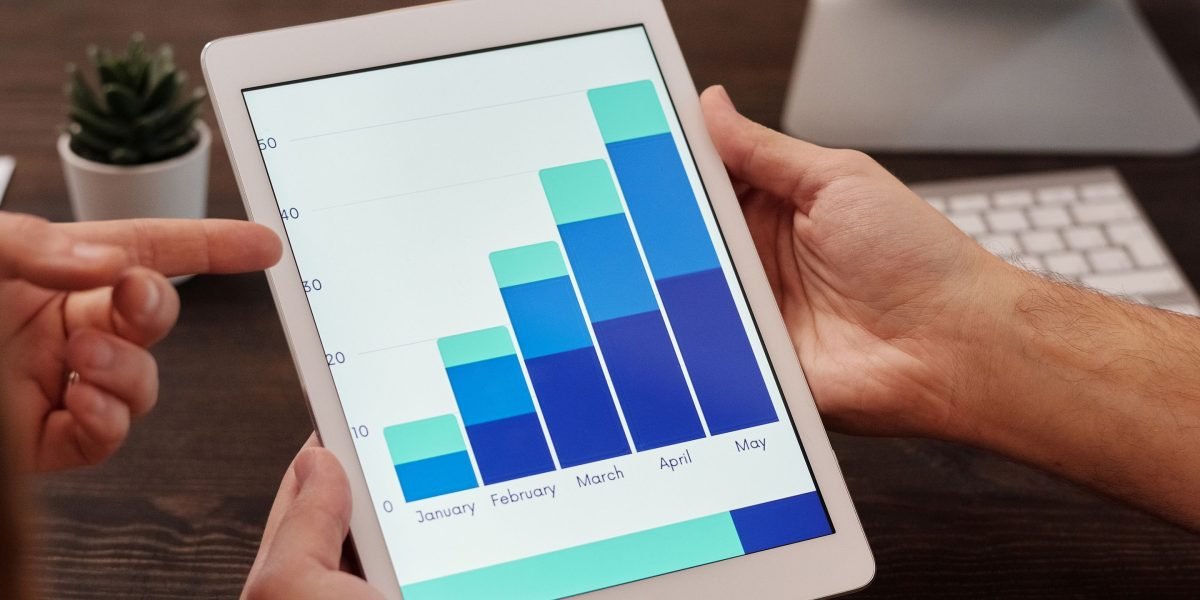 A business team celebrates positive results, reflecting the impact of good UI/UX design.