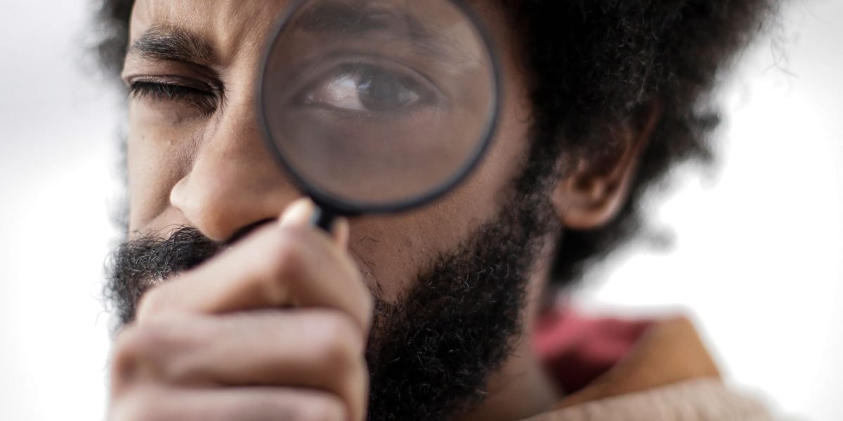 A person focused on analyzing detailed information, reflecting the need for high-quality inputs in face search.