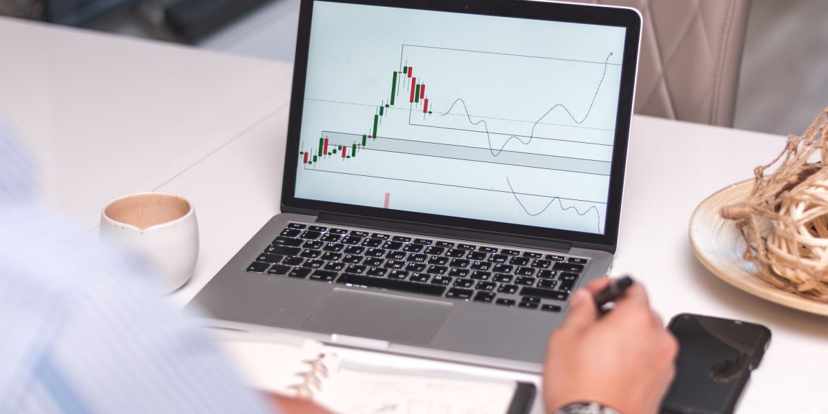 A professional reviews website analytics on a monitor, focusing on key performance indicators to optimize for speed and search engine visibility.