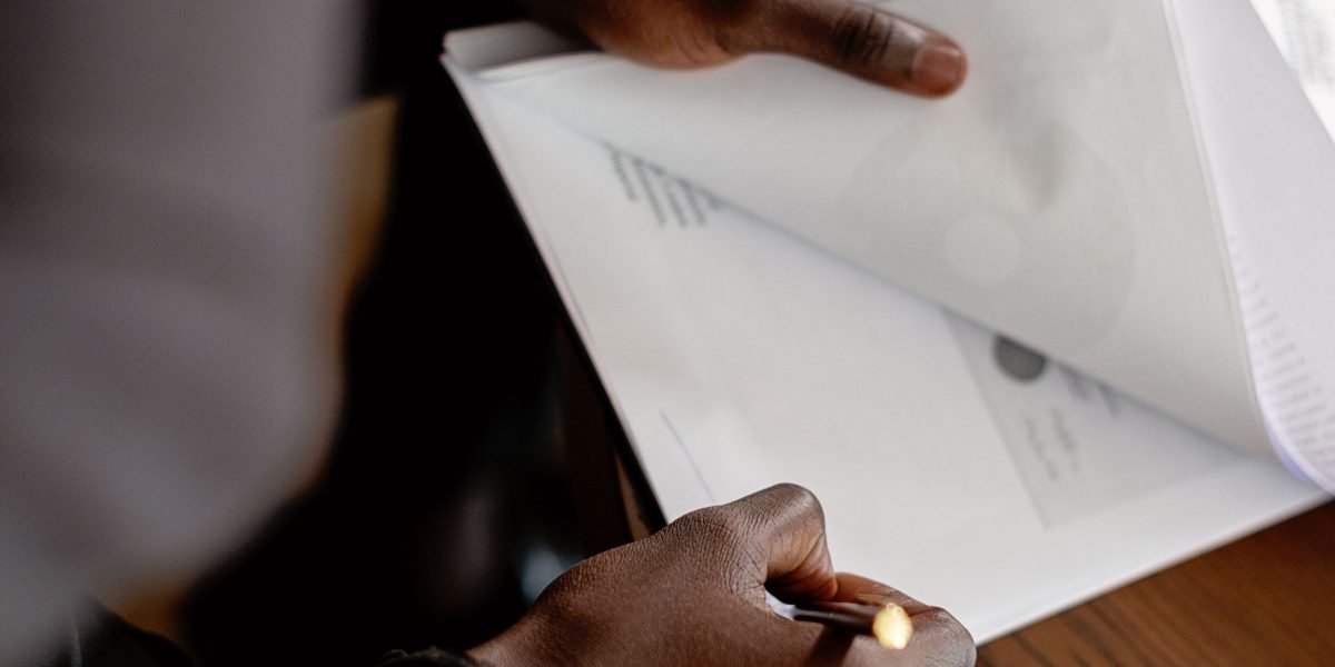 A professional reviewing a contract with a confident and focused expression, ensuring clarity.