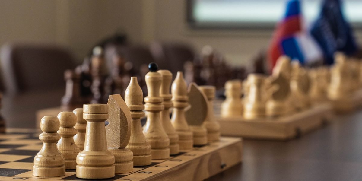 A group of professionals making strategic decisions about allocating resources for marketing execution, considering internal, outsourced, and hybrid models.