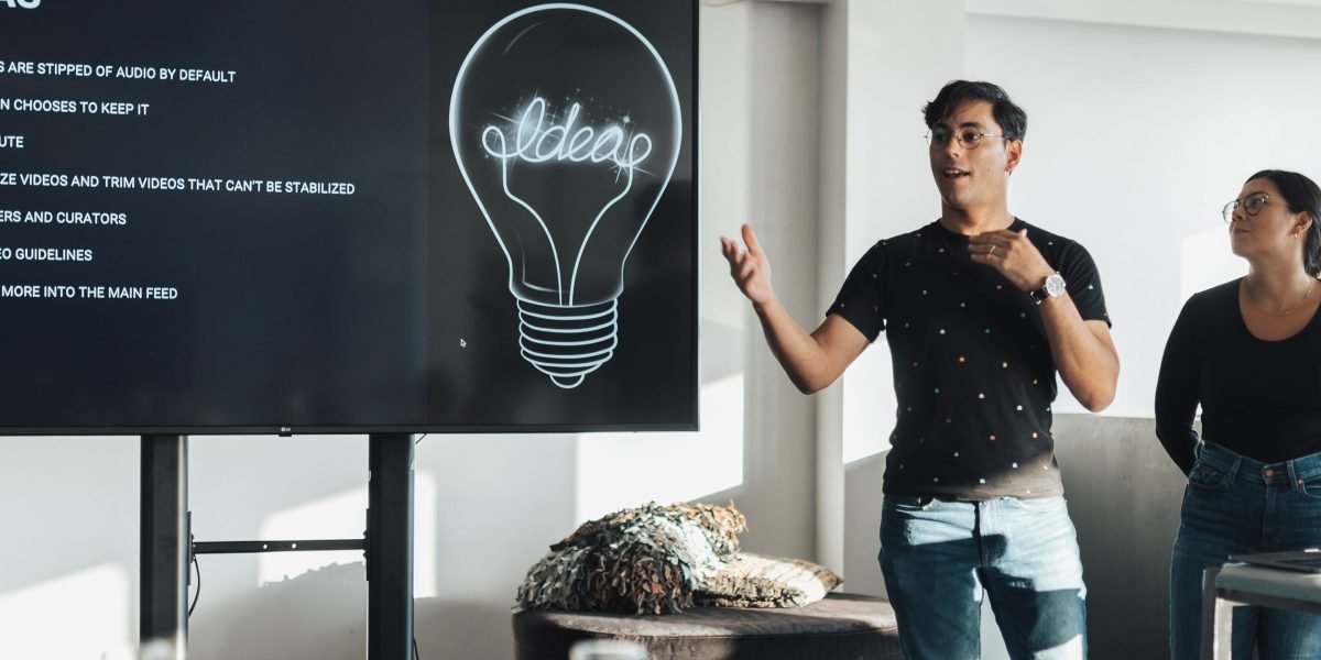 An SMB owner confidently presenting their business idea, reflecting the clarity and focus a single-page website offers.