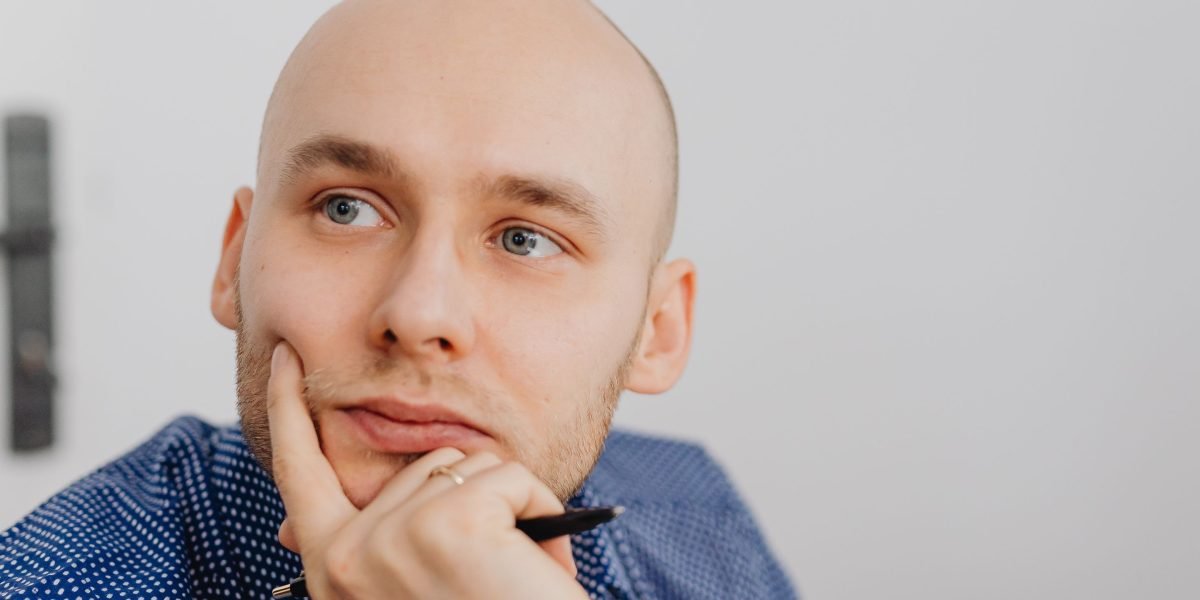 A small business owner contemplating strategies to boost online sales and customer engagement.