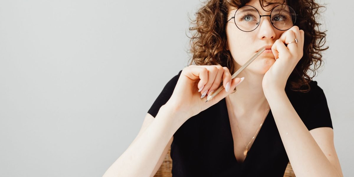 A person carefully weighing options and making a crucial business decision.
