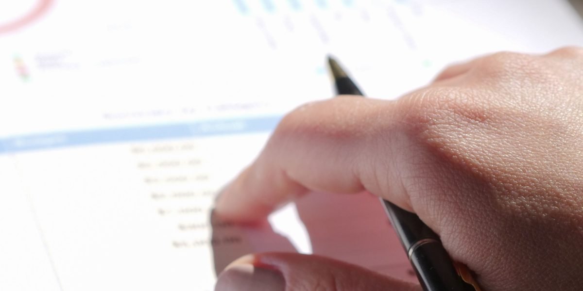 A professional reviewing detailed business reports and case studies for insights.