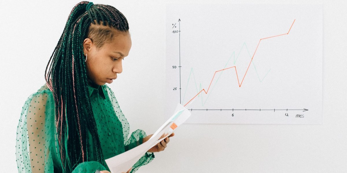 A small business owner thoughtfully reviewing plans and strategies for future growth, reflecting the challenges and opportunities in ecommerce.