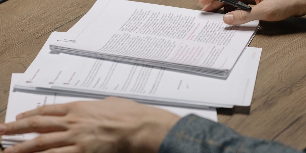 A person carefully reviewing various educational options to make an informed decision about their learning path.