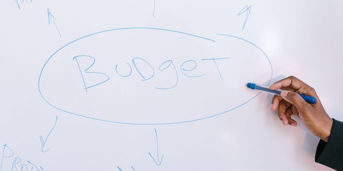 An individual thoughtfully managing their budget and exploring financing options for educational pursuits.