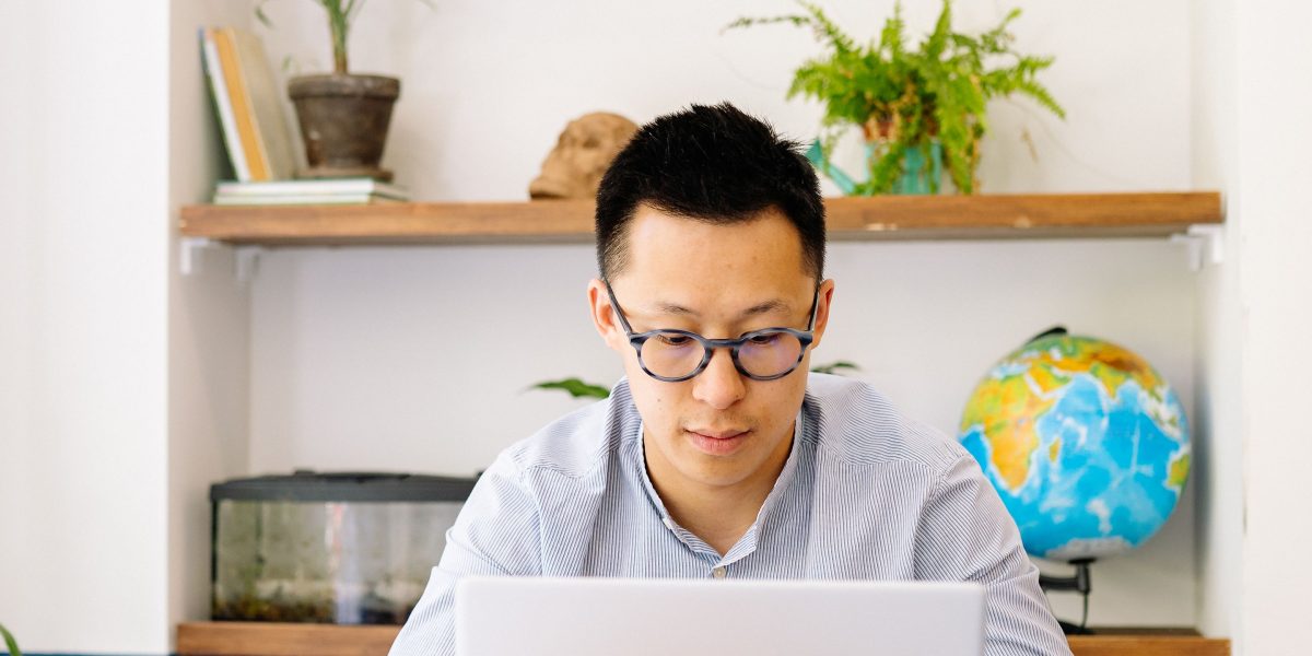 A person carefully evaluating options for professional development, emphasizing thoughtful decision-making.