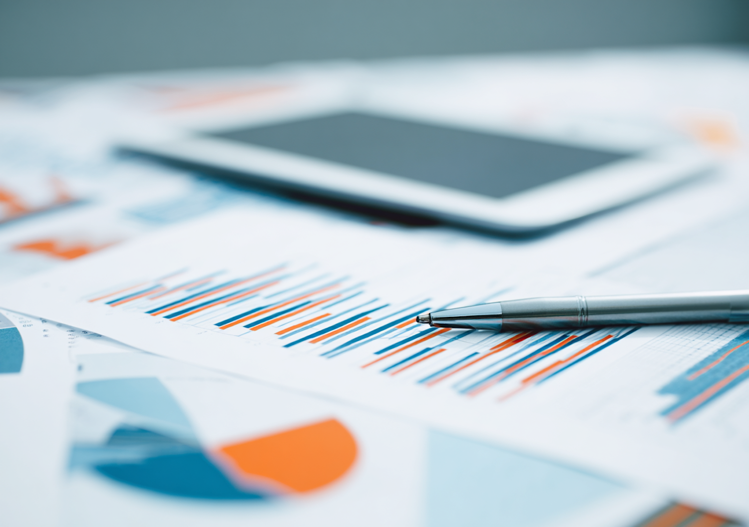 A person reviewing a detailed budget spreadsheet, emphasizing the thoughtful consideration required when evaluating SEO costs and pricing models.