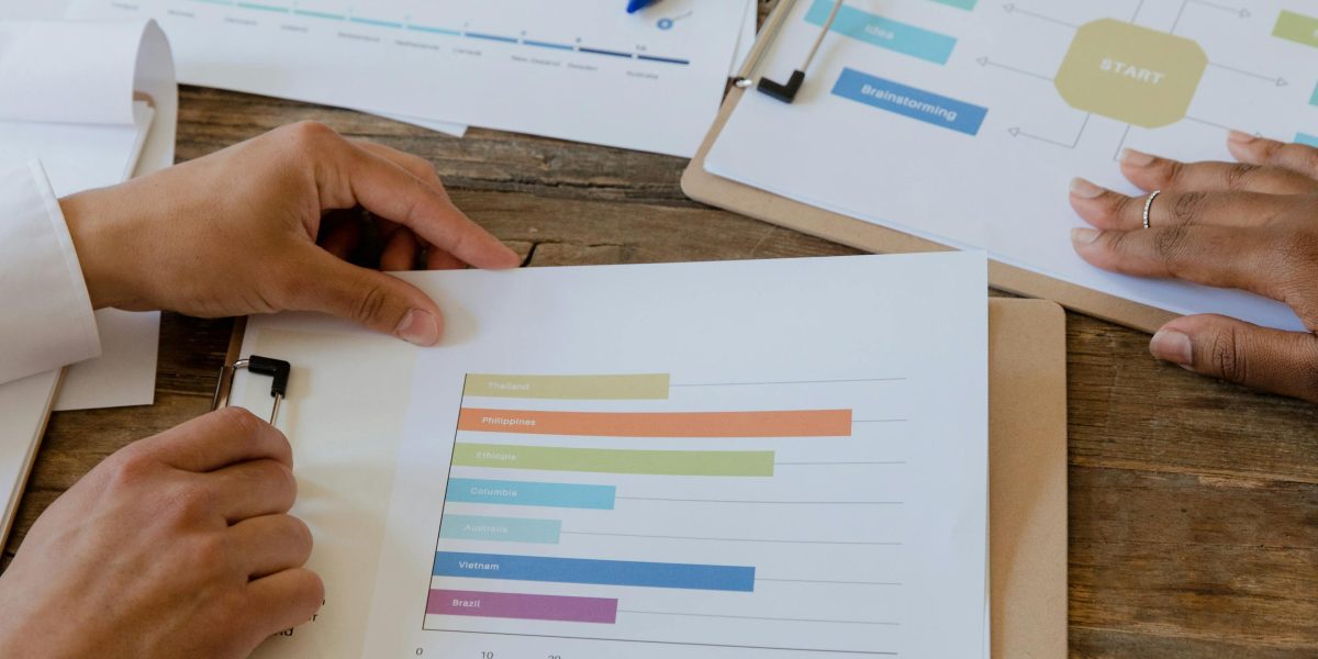 A team reviewing charts and graphs, symbolizing sustained growth through ongoing digital marketing.