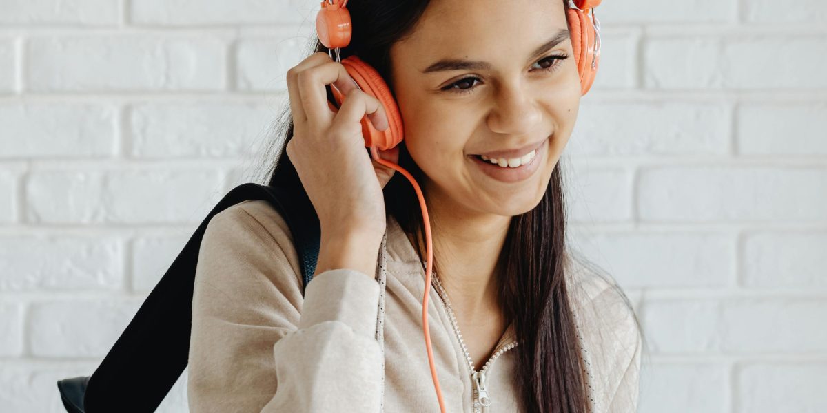 A person deeply engaged and enjoying music, symbolizing a strong customer connection.