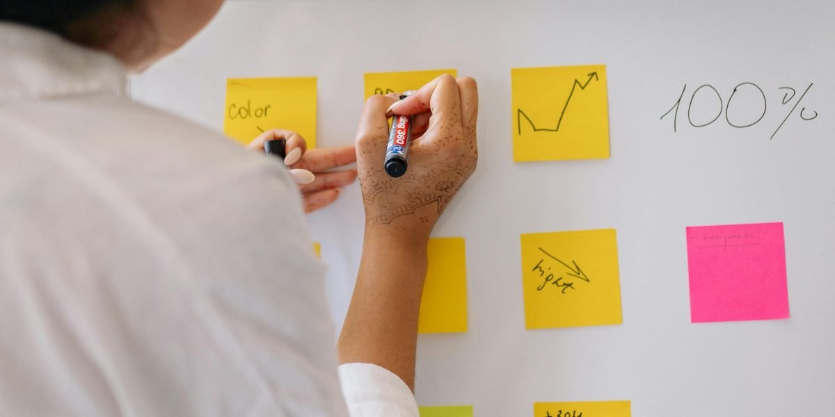 A business owner thoughtfully reviewing a strategy or plan, understanding the basics of local SEO.