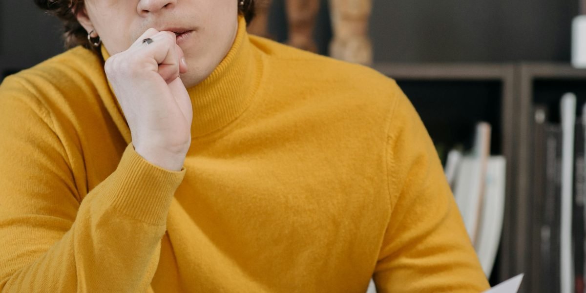 A person contemplating a choice, symbolizing a conversion decision on a website.