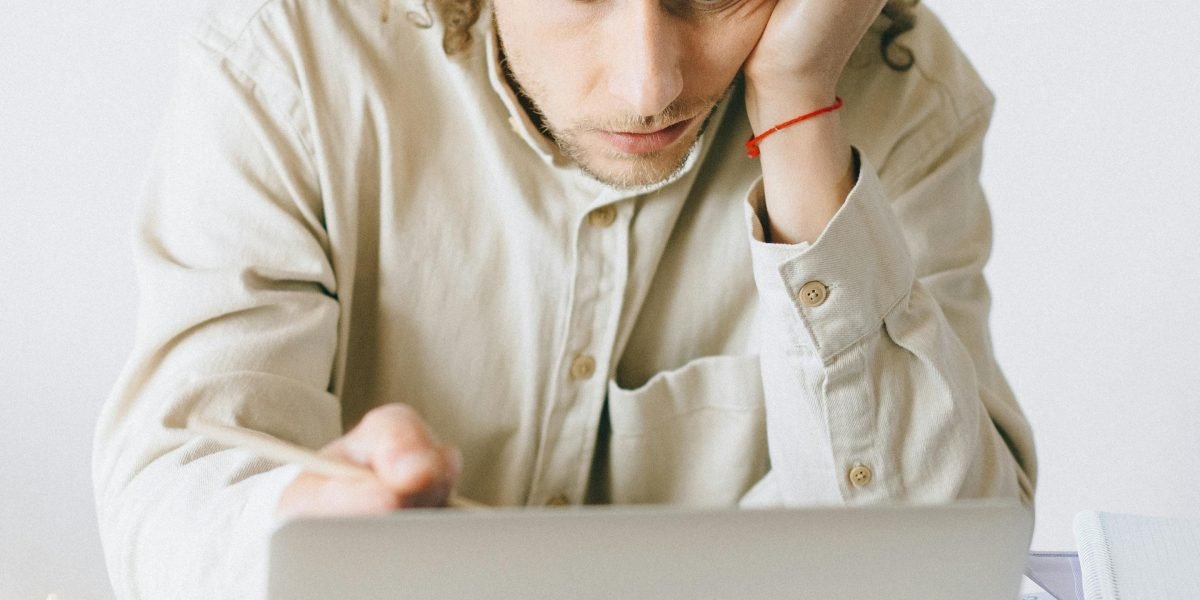 A designer experiencing frustration due to inconsistent color representation, highlighting the need for accurate displays.