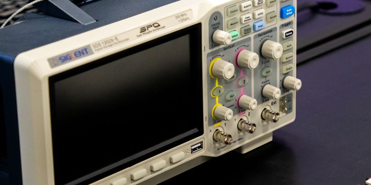 A person using a hardware calibration device to ensure precise color accuracy, a critical step for professional design workflows.