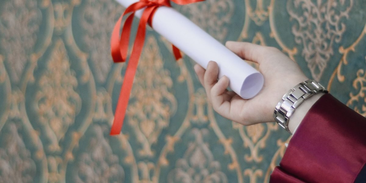 A person confidently celebrating an achievement, representing the positive outcomes and recognition gained by scholarship recipients.