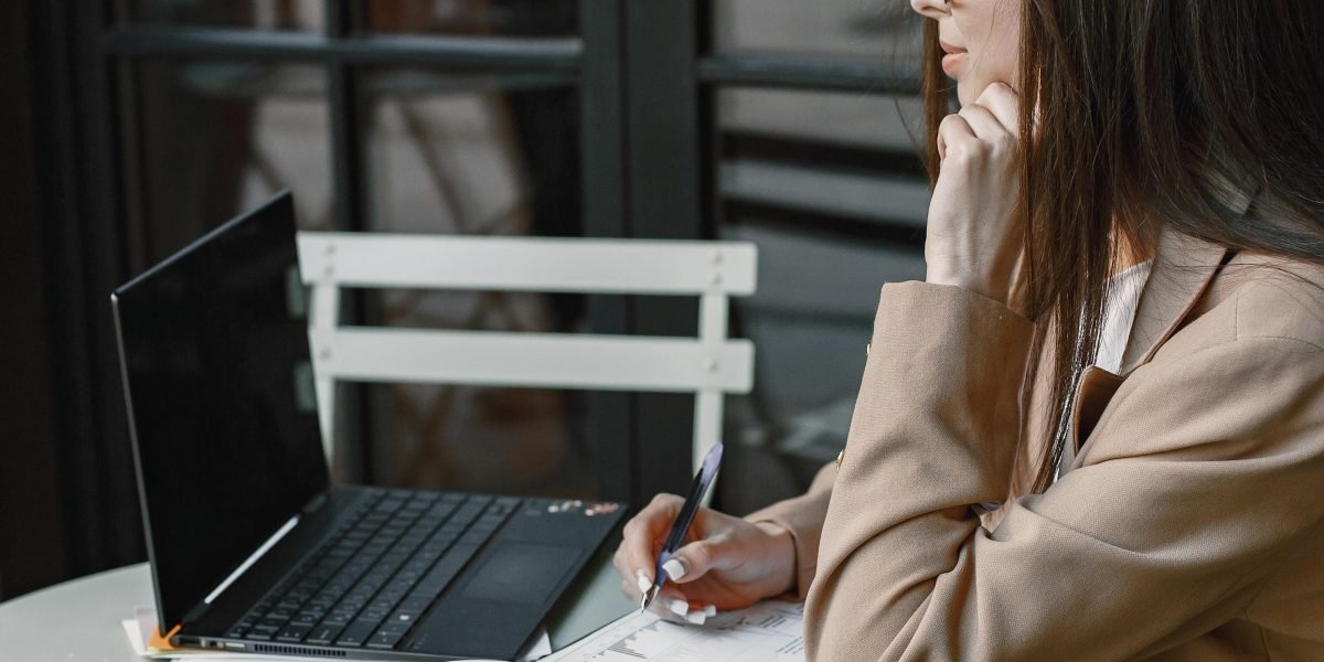 A small business owner contemplating strategies to improve online presence, reflecting on lessons from top-visited websites.